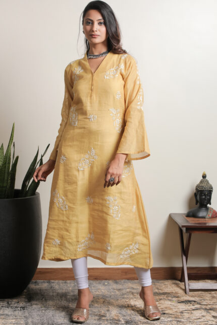 Elegant yellow Lucknowi Chikankari A-line kurta in tissue silk by Srajann.