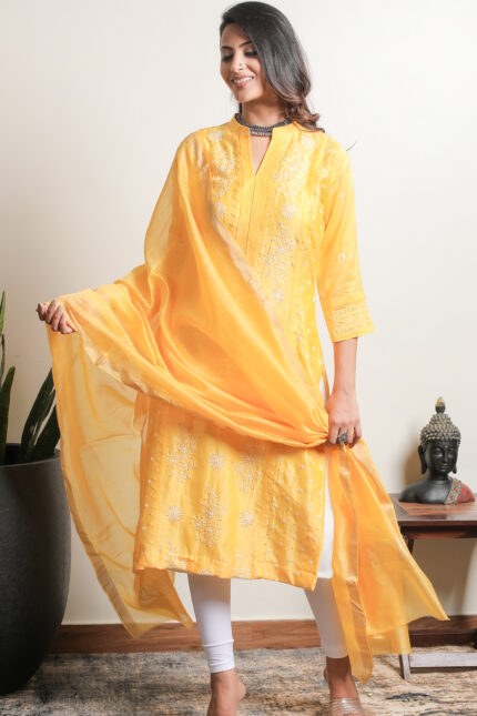 Elegant yellow Lucknowi Chikankari unstitched kurta dupatta set by Srajann.