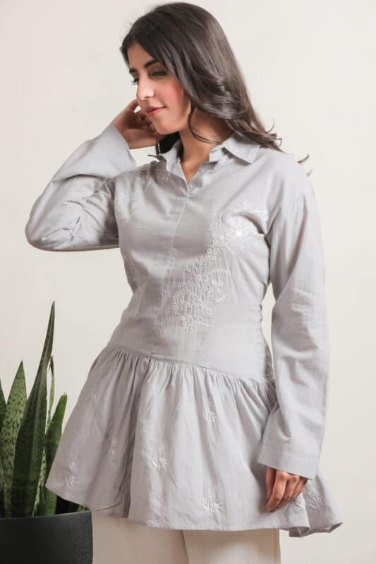 A luxurious semi-stitched suit set featuring intricate hand embellishments and delicate Lucknowi Chikankari work on Mal Chanderi fabric