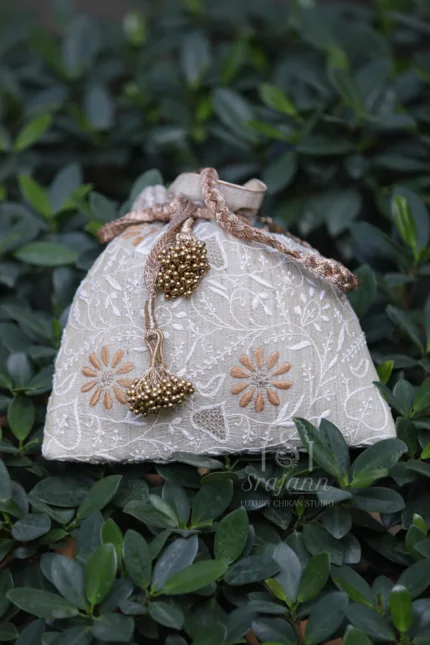 "Exquisite Handcrafted Silk Potli Bag with Traditional Lucknowi Chikankari Embroidery in Beige and Rust Tones"