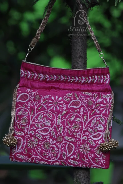 "Magenta Silk Lucknowi Chikankari Potli Bag adorned with Zari Embroidery"