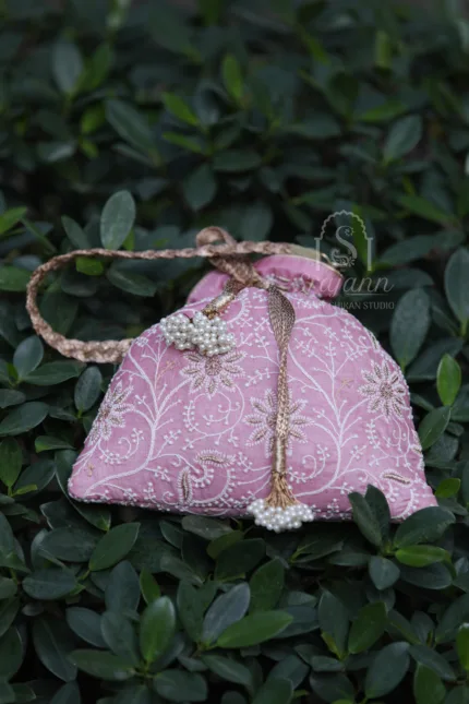 "Hand Embroidered Pink Silk Lucknowi Chikankari Potli Bag with Zari Embellishments"