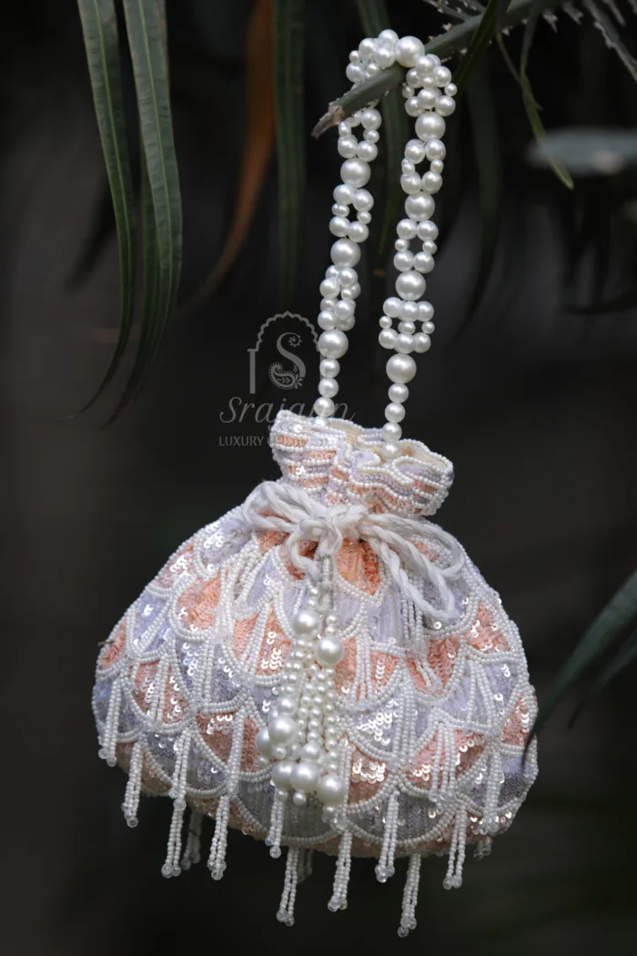 "Grey/Peach Organza Lucknowi Chikankari Potli Bag adorned with Pearl and Sequin Embellishments"
