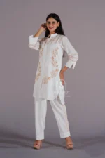 Hand-Embroidered White Linen Lucknowi Chikankari Co-Ord Set: A coordinated set featuring intricate hand embroidery in the traditional Lucknowi Chikankari style, crafted from premium white linen fabric